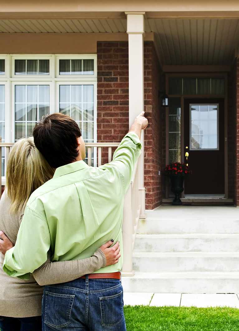 Young happy couple shopping for new home